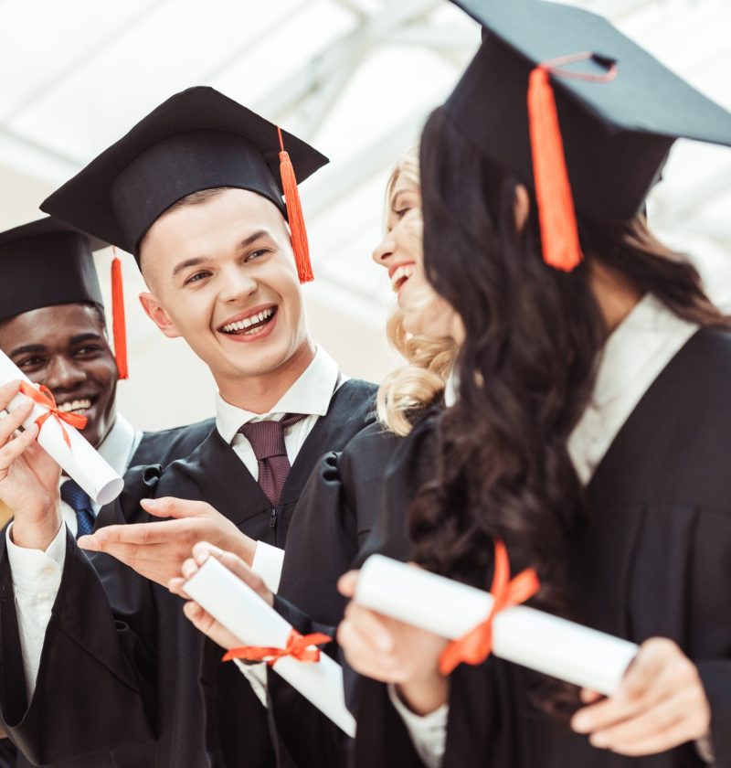 laughing-graduated-multiethnic-students-with-diplomas.jpg
